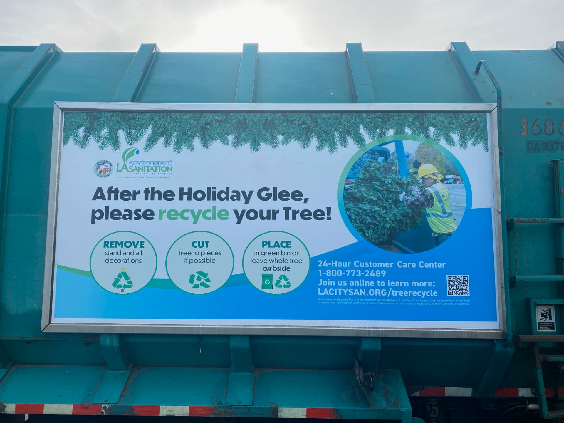 LA Sanitation & Environment truck displaying a Roadway panel asking residents to recycle their holiday tree